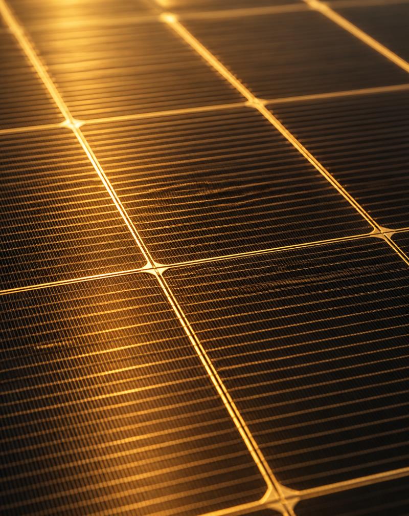 Close-up of a photovoltaic solar panel in warm light
